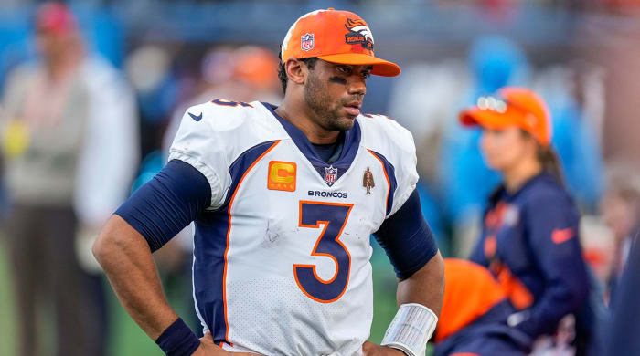 Russell Wilson puts his hands on his hips after another Broncos loss.